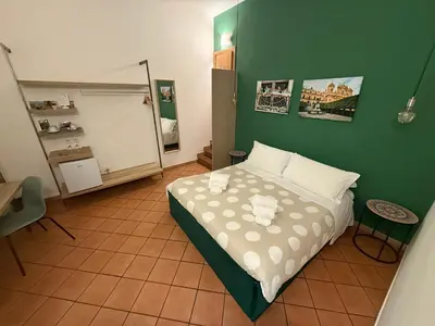 Letto o letti in una camera di Bnb San Barnaba