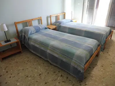 Letto o letti in una camera di Appartamento in Villa a 100 metri dal mare