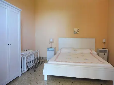 Letto o letti in una camera di Appartamento in Villa a 100 metri dal mare