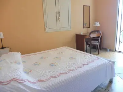 Letto o letti in una camera di Appartamento in Villa a 100 metri dal mare
