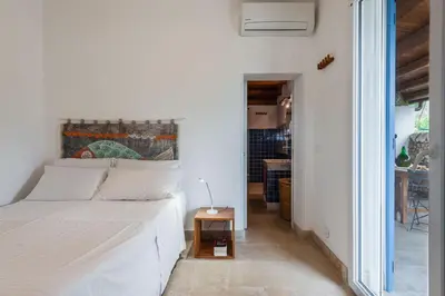 Letto o letti in una camera di Villa Fico d'India con piscina by Wonderful Italy