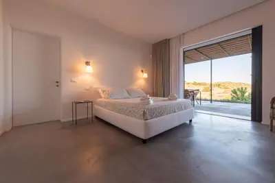 Letto o letti in una camera di Villa Vogue Retreat - IsulaTravel