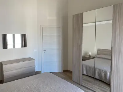 Letto o letti in una camera di Paola Confort House