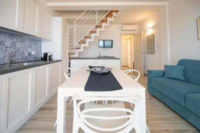 Area soggiorno di Luci Apartment Sea Beach