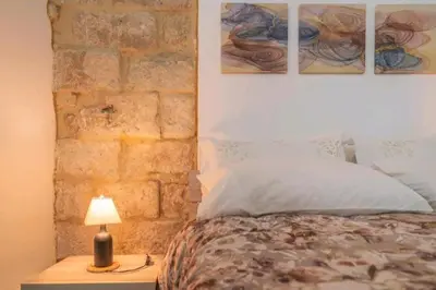Letto o letti in una camera di LA CASA DEI CANDELAI