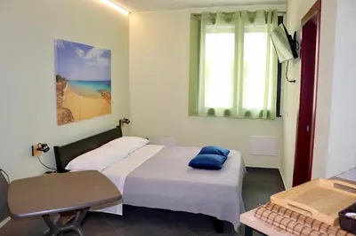 Letto o letti in una camera di Le Tre Punte B&B