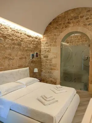 Letto o letti in una camera di Modica Charme