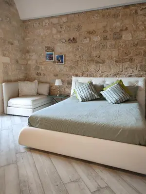 Letto o letti in una camera di Modica Charme