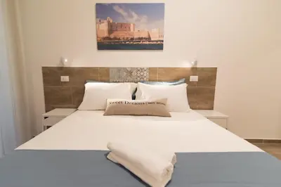 Letto o letti in una camera di RAUDINO ROOMS