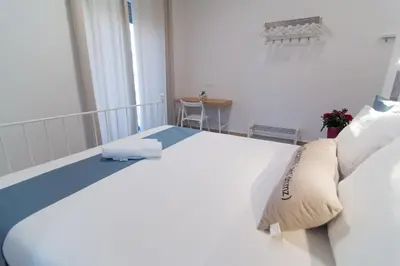 Letto o letti in una camera di RAUDINO ROOMS