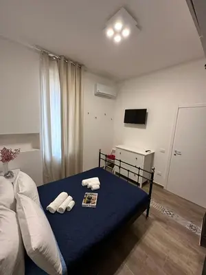 Letto o letti in una camera di RAUDINO ROOMS