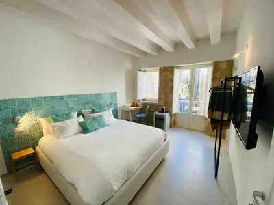 Letto o letti in una camera di Residence Le Tre Grazie - Appartamento Tàlia