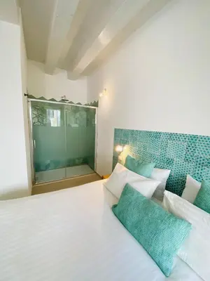 Letto o letti in una camera di Residence Le Tre Grazie - Appartamento Tàlia