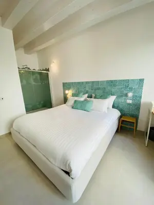 Letto o letti in una camera di Residence Le Tre Grazie - Appartamento Tàlia
