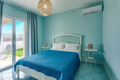 Letto o letti in una camera di Villa Arancio by Villa Plus
