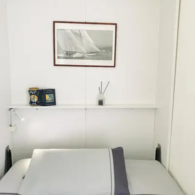 Letto o letti in una camera di LA TERRAZZA SUL PORTO