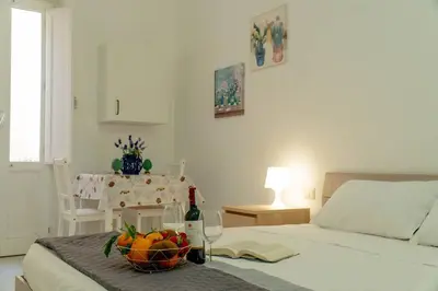 Letto o letti in una camera di Casa Charm RosaApartmentsOrtigia