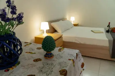 Letto o letti in una camera di Casa Charm RosaApartmentsOrtigia