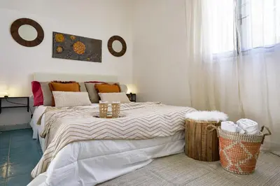 Letto o letti in una camera di Sicily Sun con accesso alla spiaggia