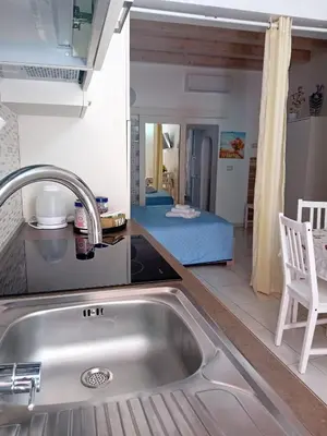 Letto o letti in una camera di Casa Rosa Apartments Ortgia