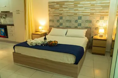 Letto o letti in una camera di Casa Rosa Apartments Ortgia