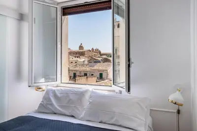Letto o letti in una camera di Mansarda Aurispa