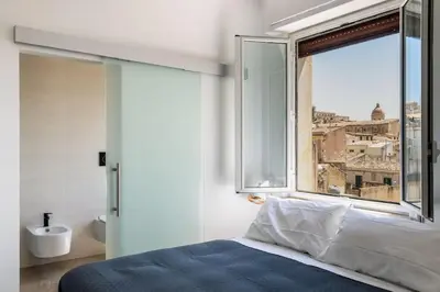 Letto o letti in una camera di Mansarda Aurispa