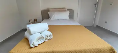 Letto o letti in una camera di Casa Vacanze Rainbow, Siracusa