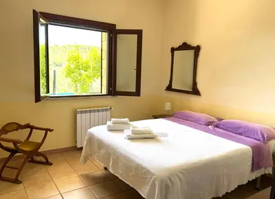 Letto o letti in una camera di Casa Vacanze Salvatore-Relax con piscina privata