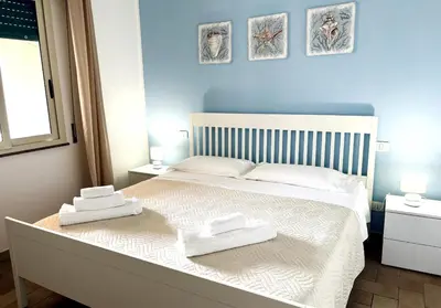 Letto o letti in una camera di La Finestra sul mare Marzamemi con Wi-Fi e posto auto