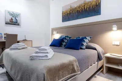 Letto o letti in una camera di Heart City Rooms