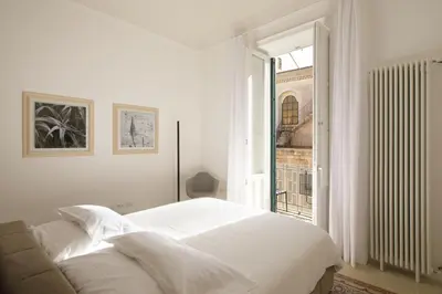 Letto o letti in una camera di L'arco di San Giuseppe