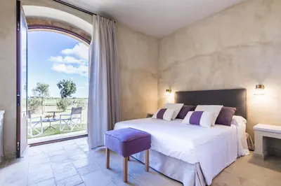 Letto o letti in una camera di Casa Vendicari Boutique Hotel