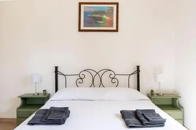 Letto o letti in una camera di Villa Dafne