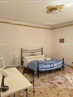 Letto o letti in una camera di L&L Home - Augusta - Siracusa