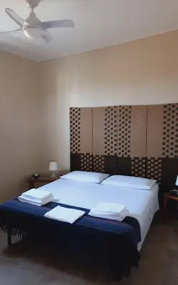 Letto o letti in una camera di Villa delle palme