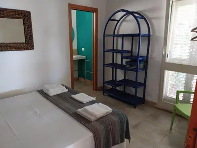 Letto o letti in una camera di Villa delle palme