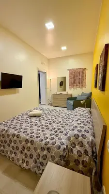 Letto o letti in una camera di Casa Pandora RosaApartmentsOrtigia
