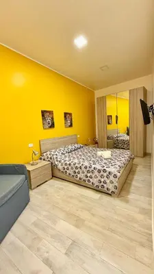 Letto o letti in una camera di Casa Pandora RosaApartmentsOrtigia