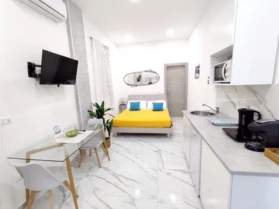 Letto o letti in una camera di La Casa di Dani e Marco vicino Ortigia, Siracusa
