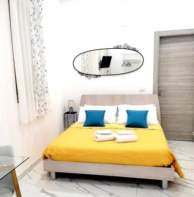 Letto o letti in una camera di La Casa di Dani e Marco vicino Ortigia, Siracusa