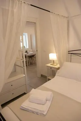 Letto o letti in una camera di Le Grazie Romantic House by Dimore Trinacria