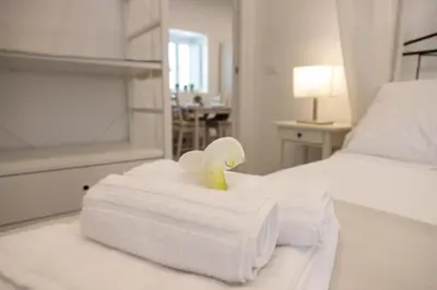 Letto o letti in una camera di Le Grazie Romantic House by Dimore Trinacria