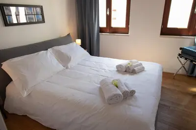 Letto o letti in una camera di Le Maree Deluxe Apartment by Dimore Trinacria