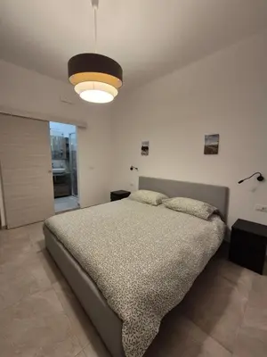Letto o letti in una camera di Sicily Neapolis Apartment & Rooms