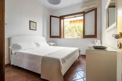 Letto o letti in una camera di {Villa Jacuzzi Privata}sul mare di Fontane Bianche