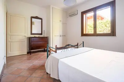 Letto o letti in una camera di {Villa Jacuzzi Privata}sul mare di Fontane Bianche
