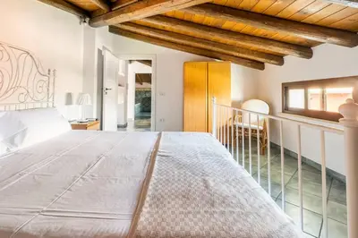 Letto o letti in una camera di {Villa Jacuzzi Privata}sul mare di Fontane Bianche
