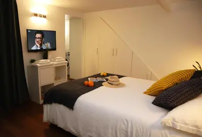 Letto o letti in una camera di Petite Suite