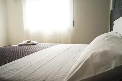 Letto o letti in una camera di LA RESIDENZA DI ADAMO
